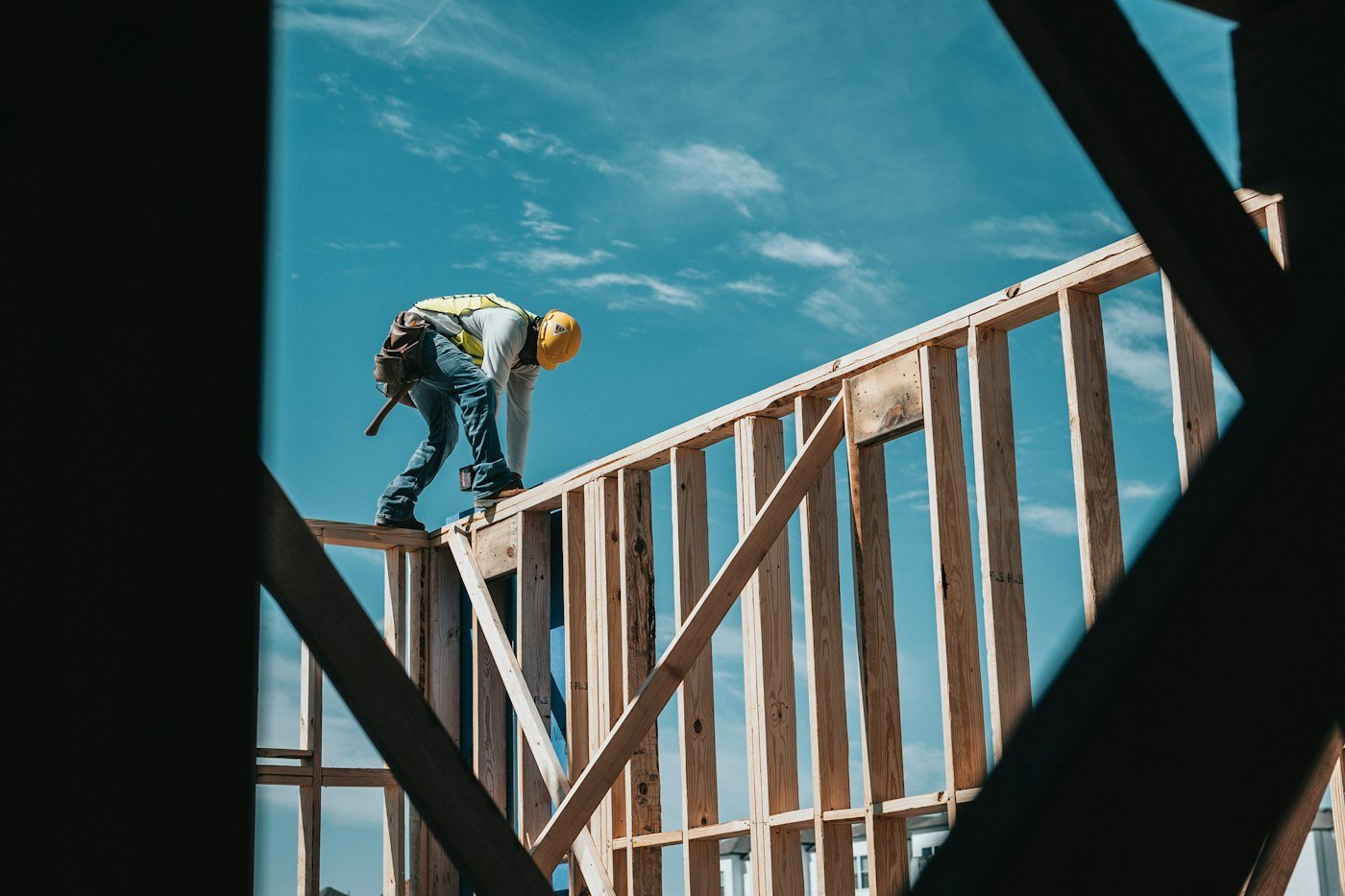 Construction worker on a timber building frame